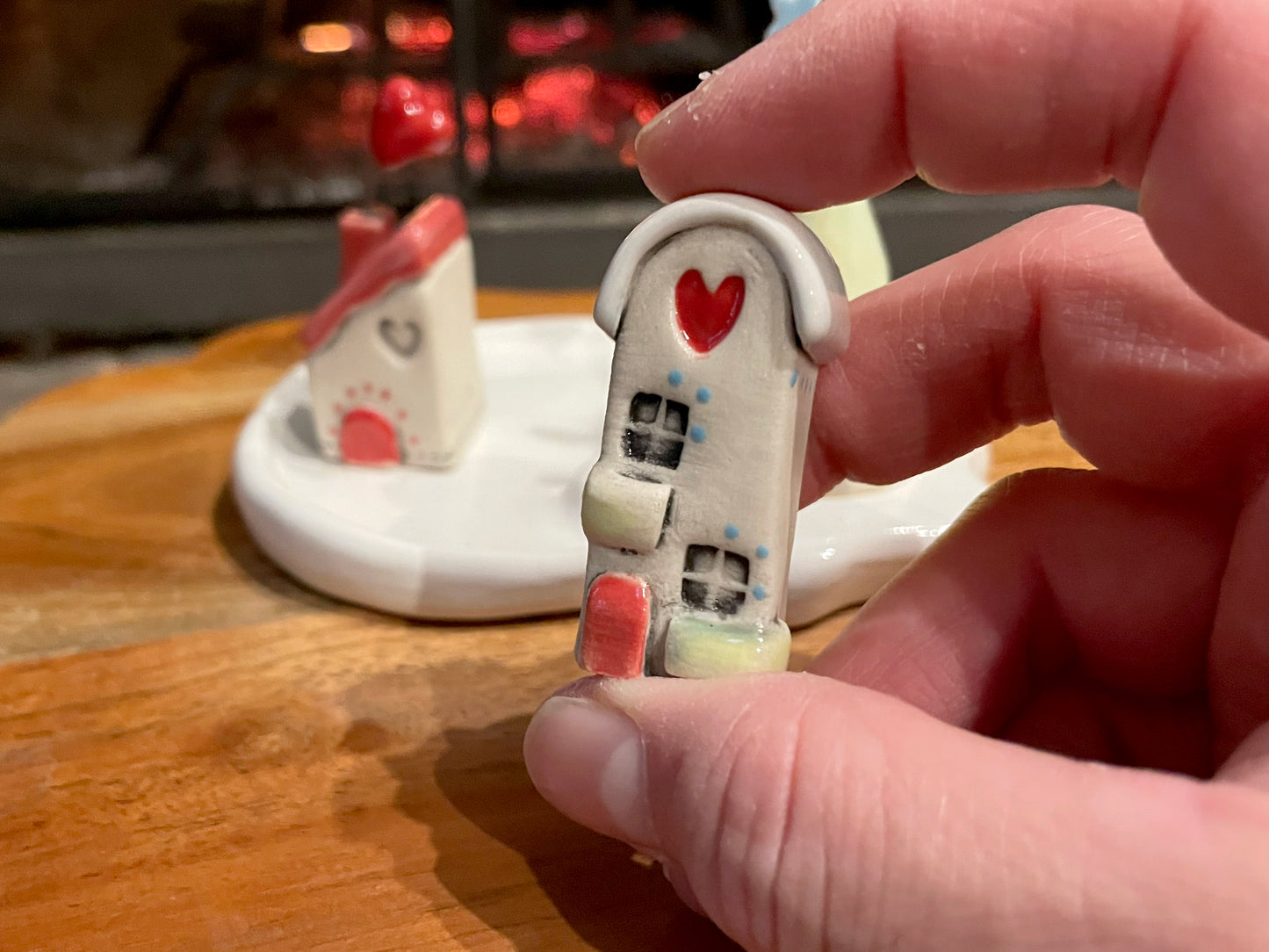 Two miniature ceramic houses with green roofs from handmade holiday village set